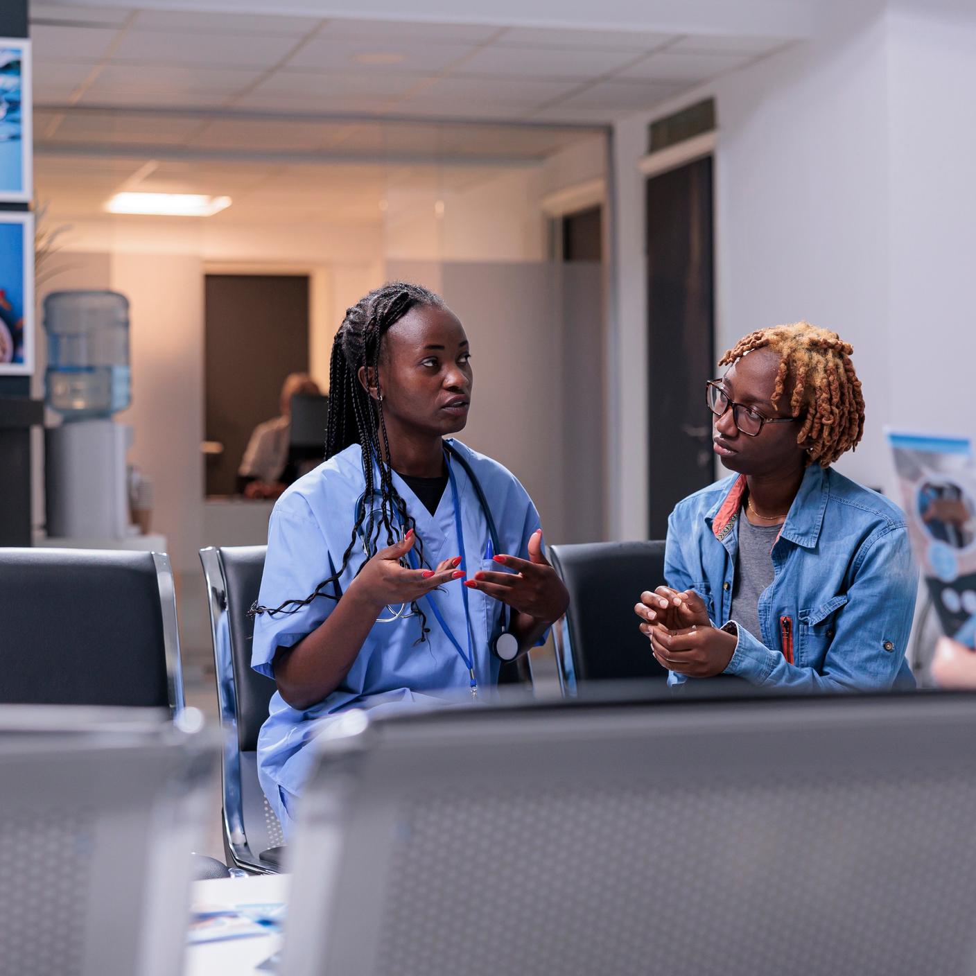 Nurse chatting to patient 
