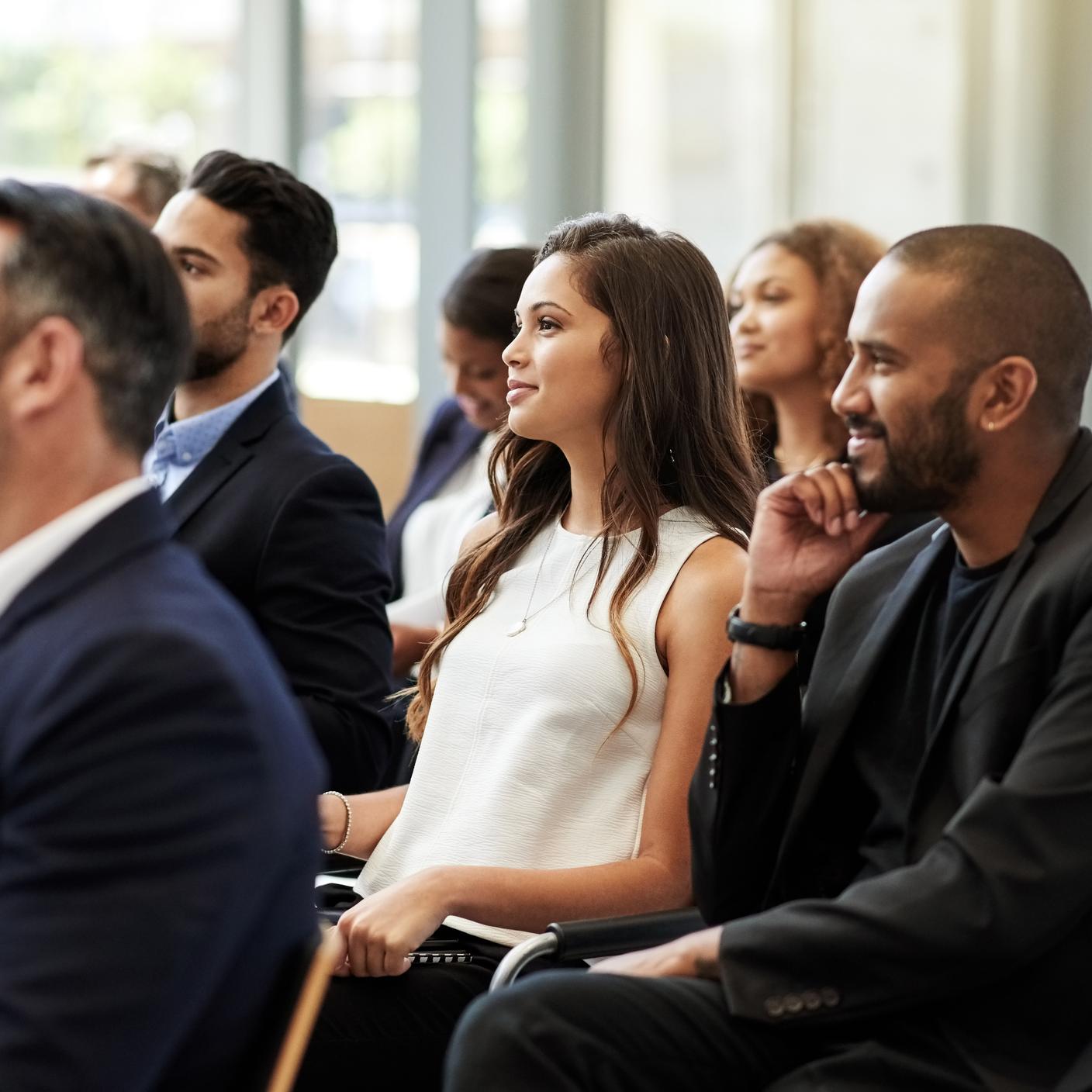 Group of people watching presentation 